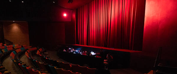 Image of McLeod Theater and a small orchestra.